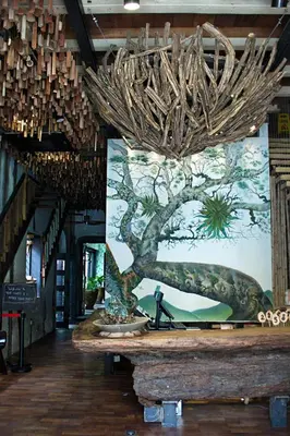 a large painting of a tree on the wall in a store at The Happy 8 Retreat @ Old Town Ipoh in Ipoh
