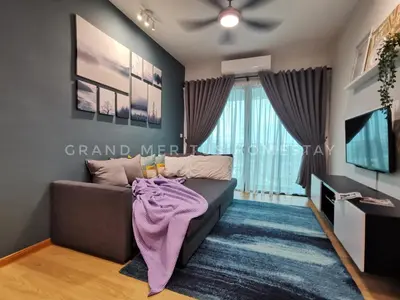 a living room with a couch and a tv at Grand Meritus Homestay @Penang in Perai