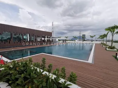 a large swimming pool in front of a building at Grand Meritus Homestay @Penang in Perai