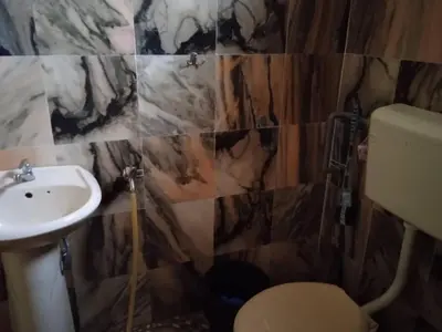 a bathroom with a toilet and a sink at Enalys Homestay untuk orang islam sahaja in Kampung Bota Kiri