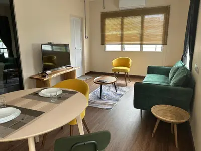a living room with a couch and a table at Garden Home Ipoh in Ipoh
