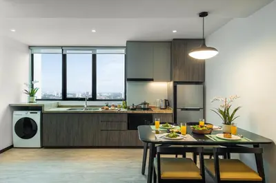 a kitchen with a table with food on it at Citadines Prai Penang in Bukit Mertajam