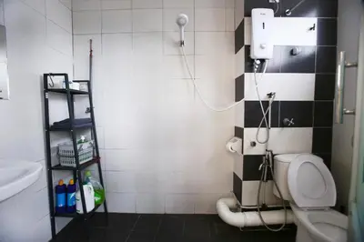 a bathroom with a toilet and a sink and a shower at Private Beanie (Private Cinema, Swing & more) at CEO Penang in Bayan Lepas