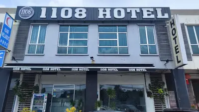 a hotel sign on the front of a building at 1108 Hotel Sungkai in Sungkai
