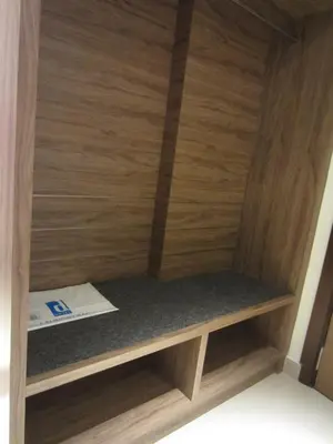 a wooden shelf with a book on it at D Hotel in Seri Iskandar