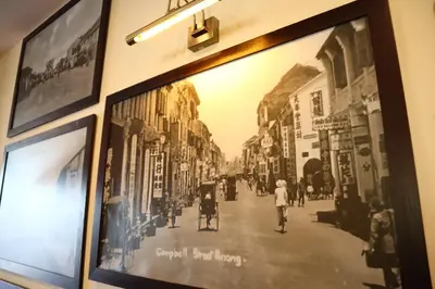 a framed picture of a street in a museum at Armenian Street Heritage Hotel in George Town