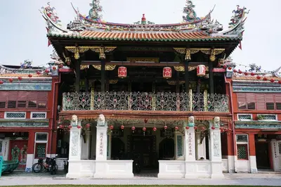 a large building with a balcony in front of it at Armenian Street Heritage Hotel in George Town