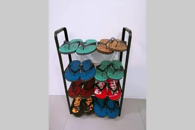 a rack with shoes and other shoes at W58 WarmStay atGoldenHill NightMarket 2R WiFi CarPark in Tanah Rata