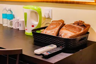 a basket of bread and a remote control on a counter at Bishop Hotel in George Town