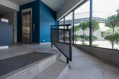 a hallway with blue walls and stairs in a building at Chariton Hotel Bagan in Butterworth