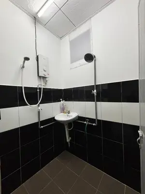 a bathroom with a sink and a shower at Homestay Teduhan Gunung, Gopeng in Gopeng