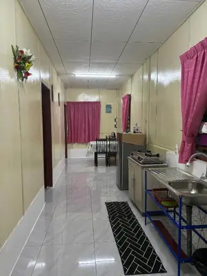 a kitchen with a sink and a counter in a room at Homestay Teduhan Gunung, Gopeng in Gopeng
