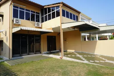 a house with a courtyard in front of it at Minden Stay in Gelugor