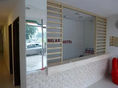 a mirror in a room with a reflection of a hotel at RELAX HOTEL in Sungai Petani