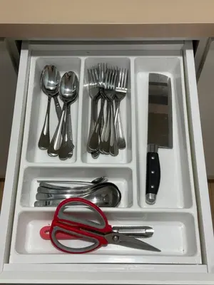 a drawer filled with utensils and a red ribbon at Mama King’s Homestay@ Palas Horizon in Brinchang