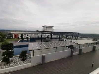 a view of a building with a swimming pool at Coco HomeStay \u65c5\u4eba\u306e\u5bb6@The Venus Sitiawan Perak in Sitiawan