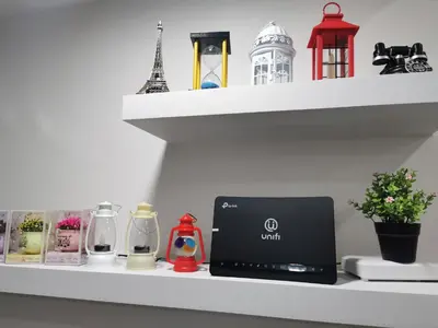 a shelf with a laptop and other items on it at Coco HomeStay \u65c5\u4eba\u306e\u5bb6@The Venus Sitiawan Perak in Sitiawan