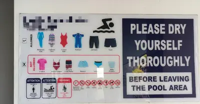 a sign that says please dry yourself previously before leaving the pool area at Deluxe and Feel like a home 1, 3-6 pax ,Netflix, Georgetown in George Town