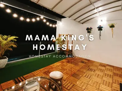 a room with a sign that says manana kings homiversary at Mama King's Homestay @ Marina Island in Kampong Batu Gajah