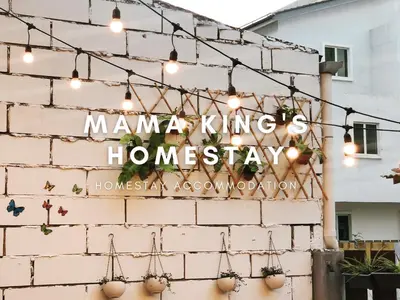 a brick wall with a sign that reads manana kings homestay at Mama King's Homestay @ Marina Island in Kampong Batu Gajah