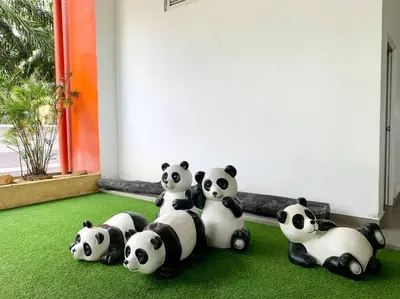 a group of pandas sitting on the floor at The Venus - Spacious Wooden TOP Floor Apartment in Sitiawan