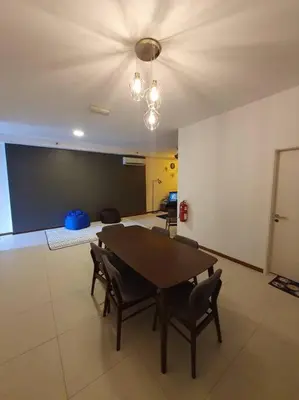 a dining room with a table and chairs in a room at Landmark By Katana 3BR Glamorous Highrise Seaview Homestay Gurney\u65e0\u654c\u6d77\u666f\u4e09\u623f\u5957\u623f in Tanjong Tokong