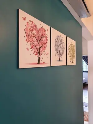 four paintings of trees hanging on a wall at Landmark By Katana 3BR Glamorous Highrise Seaview Homestay Gurney\u65e0\u654c\u6d77\u666f\u4e09\u623f\u5957\u623f in Tanjong Tokong