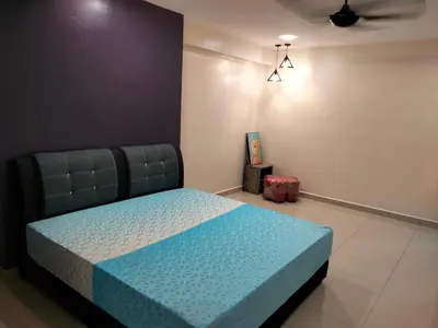 a bedroom with a blue bed in a room at WL Homestay in Sitiawan