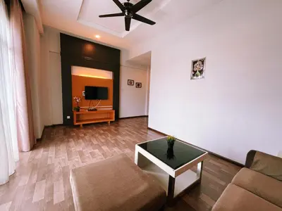 a living room with a couch and a table at Nova Apartments near Kea Farm in Brinchang
