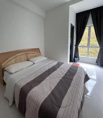 a bedroom with a bed and a large window at Cameron Emerald Avenue 2 @ Brinchang in Brinchang