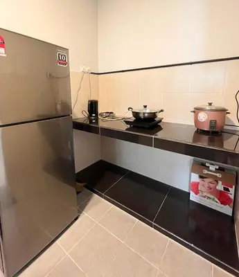 a kitchen with a stainless steel refrigerator and a stove at Cameron Emerald Avenue 2 @ Brinchang in Brinchang