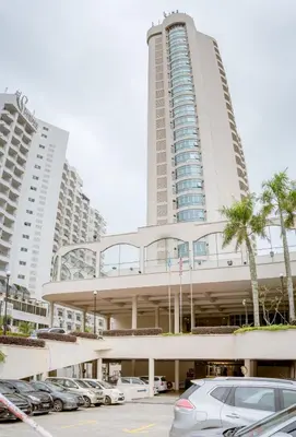 a parking lot in front of a large building at J Beach Suites At Rainbow Paradise in Tanjung Bungah