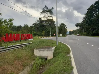 a sign on the side of a road at Homestay Zaki D'Gerik in Gerik