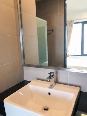 a white sink in a bathroom with a mirror at Tropicana 218 Macalister Seaview Water Purifier Studio in George Town