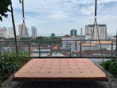 a swing with a view of a city at Tropicana 218 Macalister Seaview Water Purifier Studio in George Town