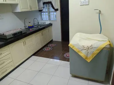 a kitchen with a sink and a counter top at KH Homestay Comfy N Calm in Seri Manjung
