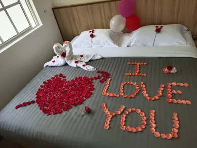 a bed with a sign that says i love at Hillview Inn Cameron Highlands PROMO in Tanah Rata