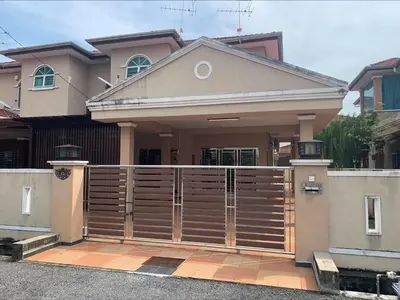 a house with a wooden gate in front of it at \u7231\u6c11\u5bbf Love House in Sitiawan