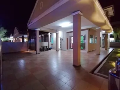 a building with a lit up patio at night at \u7231\u6c11\u5bbf Love House in Sitiawan