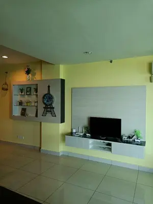 a living room with a flat screen tv on a wall at Mansion One Peaceful Homestay in George Town
