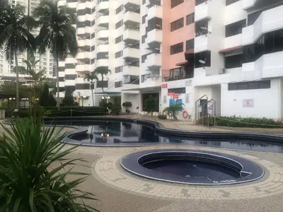 a building with a pool in front of a building at Beach Resort 7 Home Stay SRI SAYANG APARTMENT BATU FERRINGHI 3BEDROOM in Batu Ferringhi