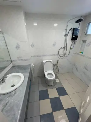 a bathroom with a toilet and a sink at EquatorialHillResort SunsetView 10Min Popular FARM in Brinchang