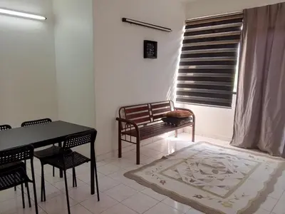 a dining room with a table and chairs and a bench at Homestay Idaman Penang in Permatang Pauh