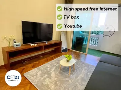 a living room with a television and a tv box at Instagramable Luxury Suites for Couples or Families • Straits Quay Penang • Sea View Balcony • Private Bathtub in Bagan Jermal