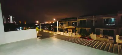 a view of a rooftop of a building at night at IPOH staycation in Ipoh