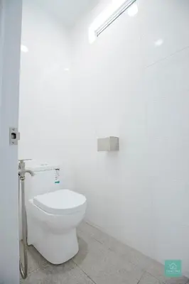 a bathroom with a white toilet in a stall at Jomstay MUJI 19 & 7 INN Ipoh Garden 8-10 pax in Ipoh