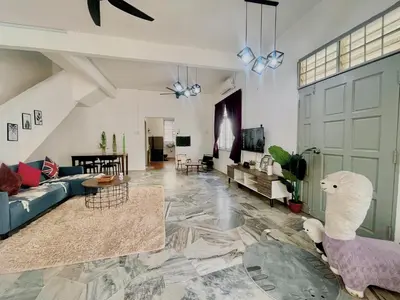 a living room with a couch and a table at Entire Residential House Alma Bukit Mertajam Spacious 4 bedroom in Bukit Mertajam