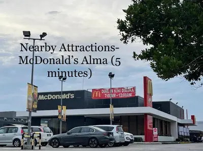 a mall with cars parked in a parking lot at Entire Residential House Alma Bukit Mertajam Spacious 4 bedroom in Bukit Mertajam