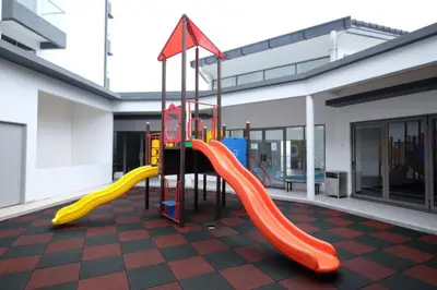 a playground with a slide in a building at PLAY at Palas Horizon @ Kea Farm in Cameron Highlands