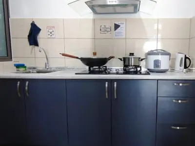 a kitchen with a stove with a pan on it at PLAY at Palas Horizon @ Kea Farm in Cameron Highlands